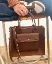 BOLSO DE MANO CHOCOLATE